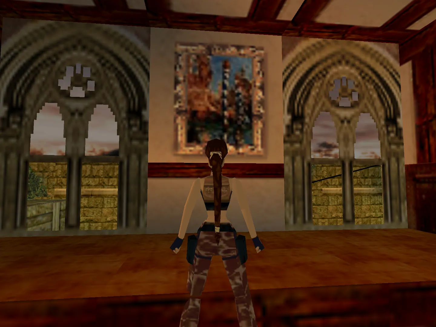 Capture d'écran du jeu Tomb Raider III. On y voit le personnage de Lara Croft dans son manoir, devant une peinture de Manet représentant le Grand Canal de Venise.