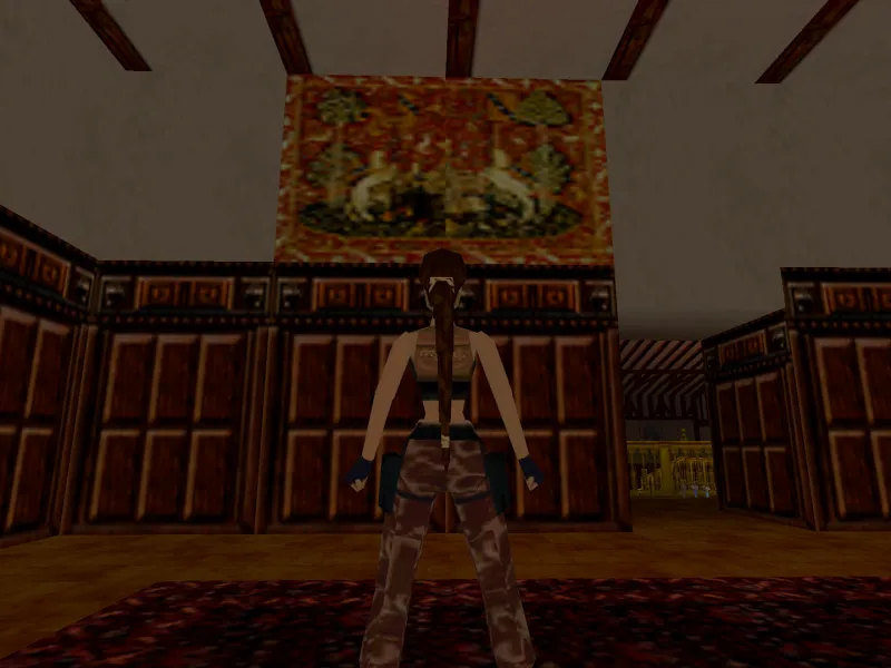Capture d'écran du jeu Tomb Raider III. On y voit le personnage de Lara Croft qui se tient devant une tapisserie reprenant l'image d'une tapisserie de la tenture de la Dame à la Licorne.