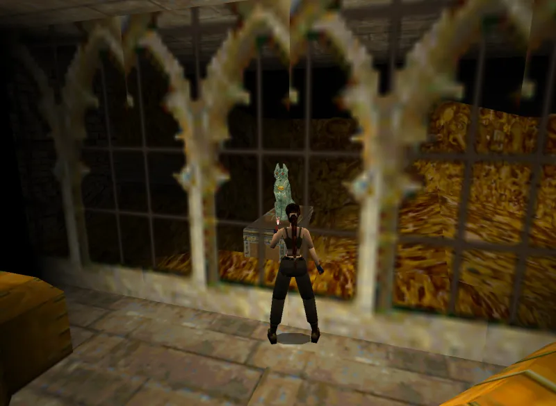 Capture d'écran de Tomb Raider II dans laquelle on voit le trésor de Lara Croft, et notamment une sculpture égyptienne en bronze représentant la déesse Bastet