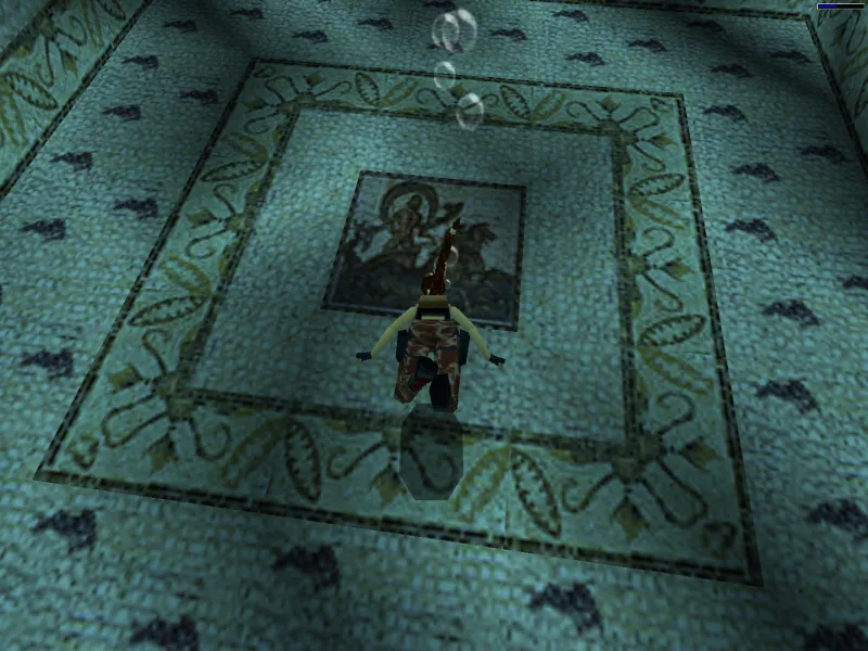 Capture d'écran du jeu Tomb Raider III. On y voit le personnage de Lara Croft sous l'eau, dans la piscine de son manoir, devant la mosaïque ornant le fond de la piscine. Cette mosaïque reprend les motifs d'une mosaïque romaine découverte à Sousse, qui représente le dieu Neptune sur son char, tiré par deux chevaux à queue de poisson