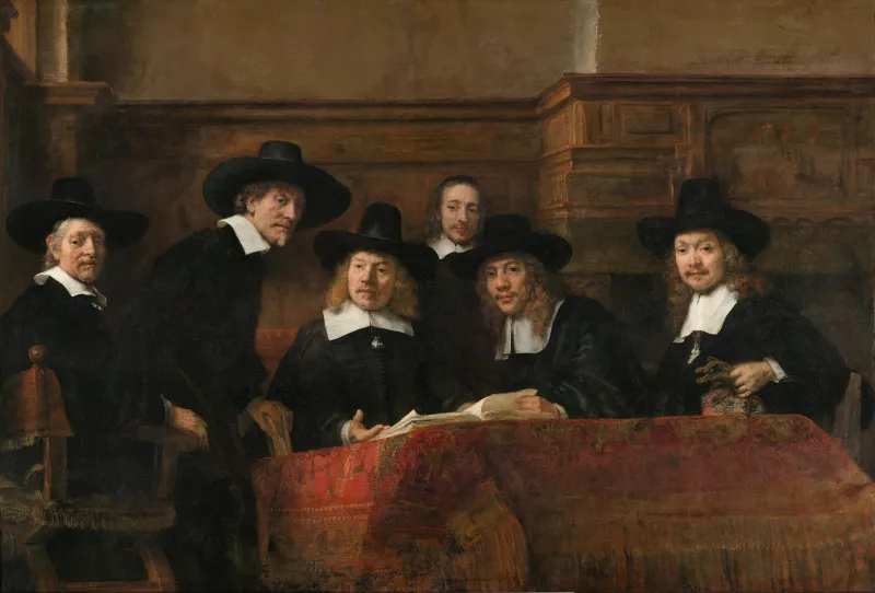 L'image est une peinture représentant une assemblée de six hommes vêtus à la mode du XVIIe siècle hollandais, vêtements noirs à large cols blancs, chapeaux à large bord noir. Ils se tiennent rassemblés autour d'une table couverte d'une tapisserie rouge, et ils tournent tous leur regard vers le spectateur.